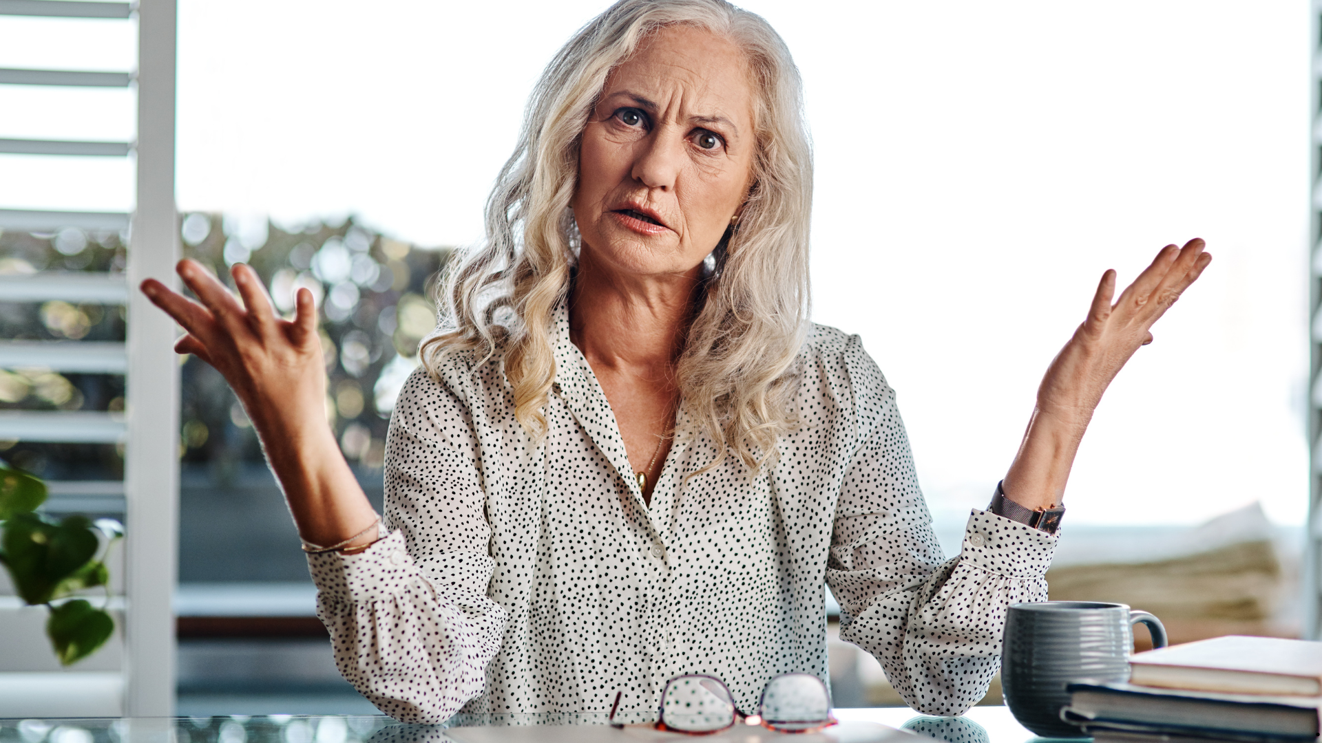Middle age woman, shrugging