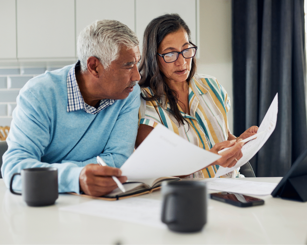 Homeowners reviewing a home inspection report to understand what the inspector found.